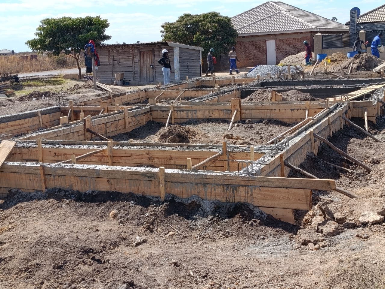 Foundation trenches and formwork on a housing stand