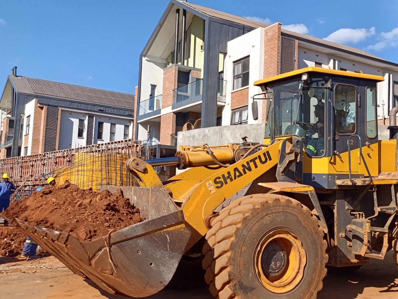 Front-end loader working at a residential development