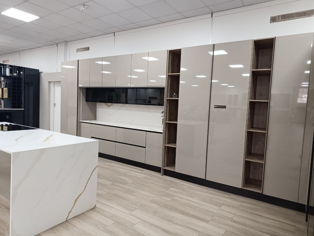 Kitchen cabinetry with island in marble finish