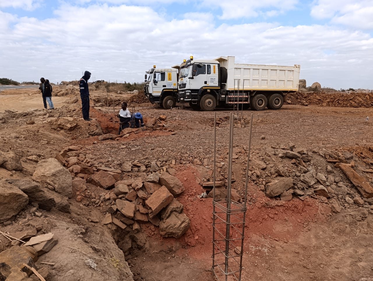 Tipper trucks delivering material to a site